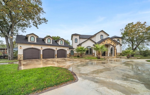 view of front of home with a garage and a front yard