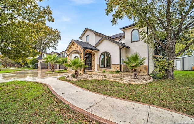 view of front facade with a garage and a front yard