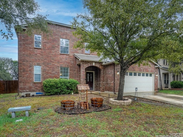 view of front of property with a garage and a front lawn