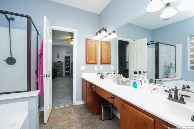 bathroom featuring vanity and shower with separate bathtub