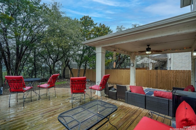 deck with ceiling fan and an outdoor hangout area