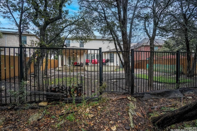 view of gate featuring covered porch