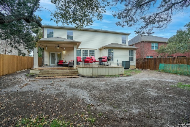 back of house with a wooden deck, ceiling fan, outdoor lounge area, and cooling unit