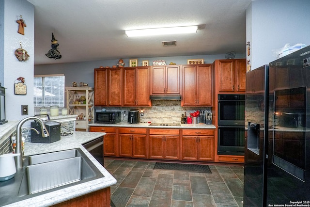 kitchen featuring sink, decorative backsplash, and black appliances