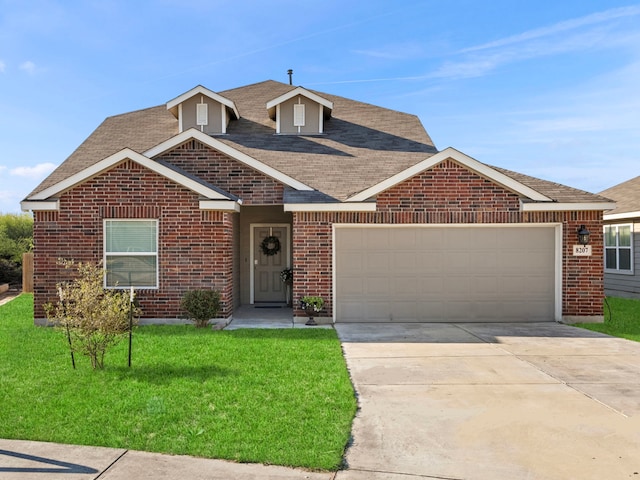 view of front facade with a garage and a front lawn