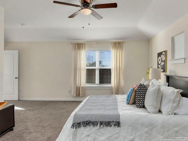 carpeted bedroom featuring lofted ceiling and ceiling fan