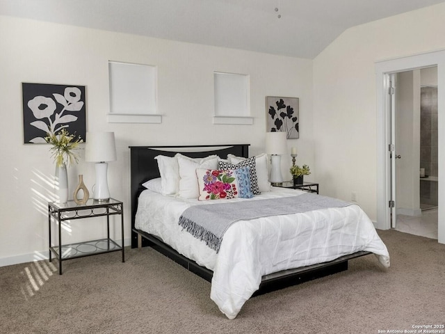 carpeted bedroom featuring lofted ceiling