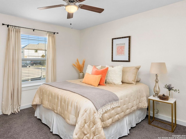 bedroom featuring ceiling fan and carpet