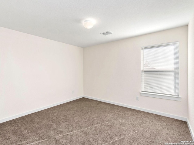 spare room featuring carpet flooring