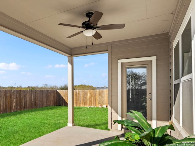 exterior space featuring ceiling fan and a patio area