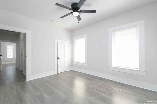 unfurnished room featuring ceiling fan and hardwood / wood-style floors