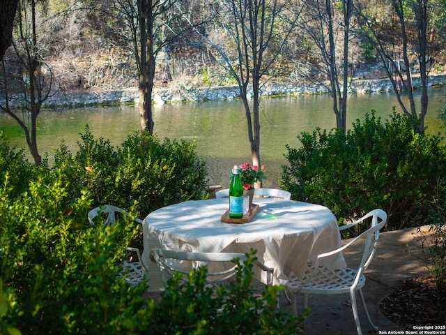 view of patio / terrace with a water view