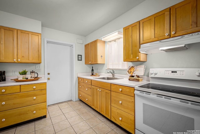 kitchen with light tile patterned flooring, sink, and white electric range oven