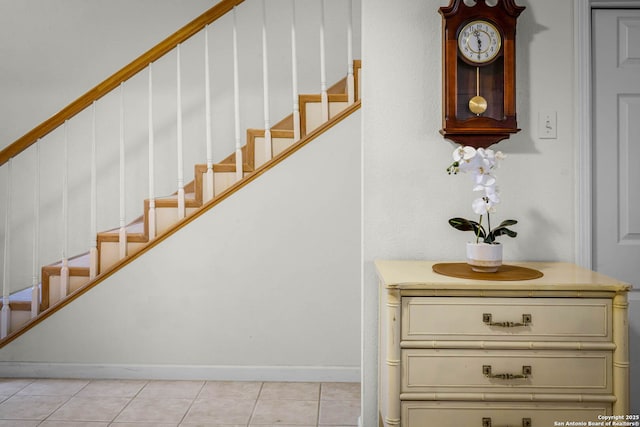 stairs with tile patterned floors