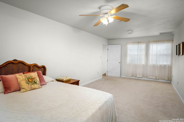 bedroom featuring ceiling fan and light colored carpet