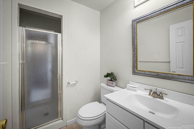 bathroom with vanity, toilet, and walk in shower