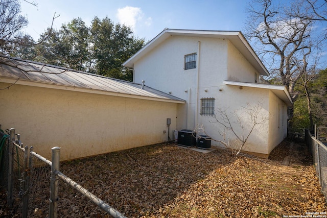 view of home's exterior featuring cooling unit