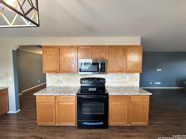 kitchen featuring dark hardwood / wood-style flooring, black range with electric stovetop, light stone countertops, and backsplash