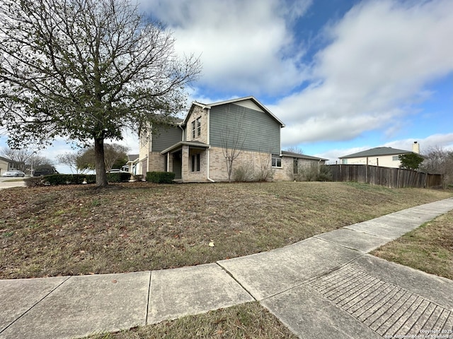 view of home's exterior with a yard