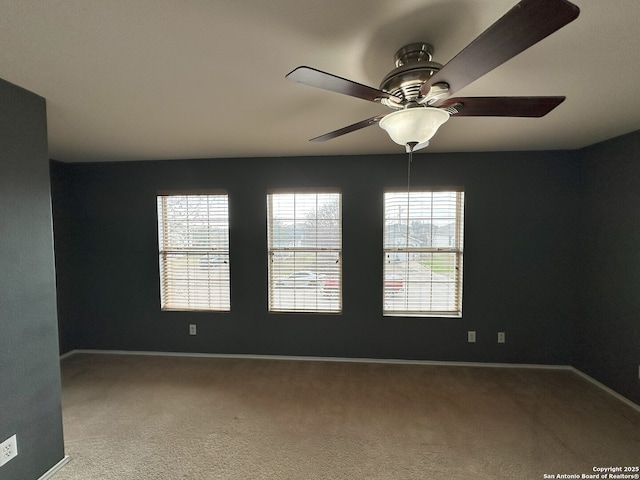 carpeted empty room with ceiling fan