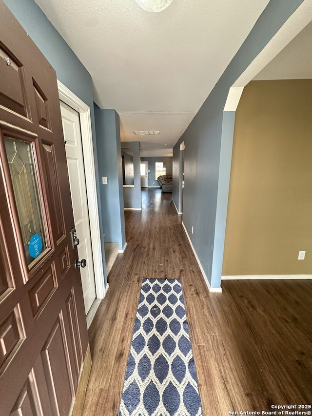 hall featuring dark wood-type flooring