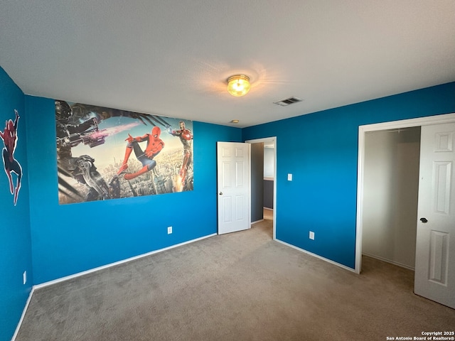 unfurnished bedroom featuring carpet