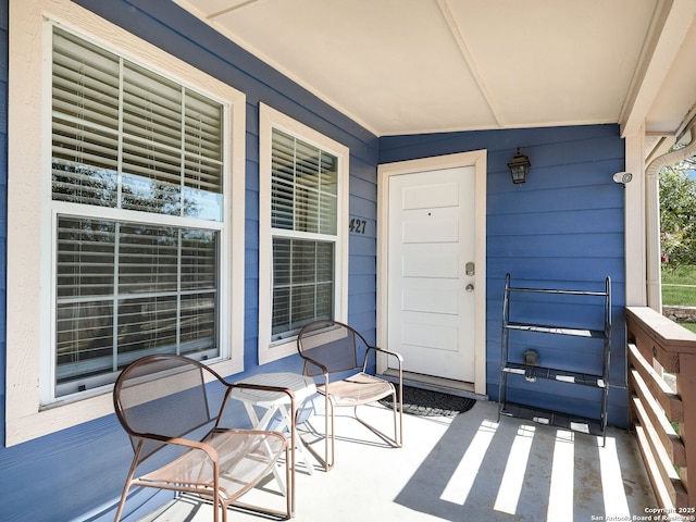 property entrance featuring covered porch