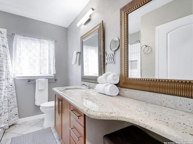 full bathroom with tile patterned flooring, baseboards, vanity, and toilet