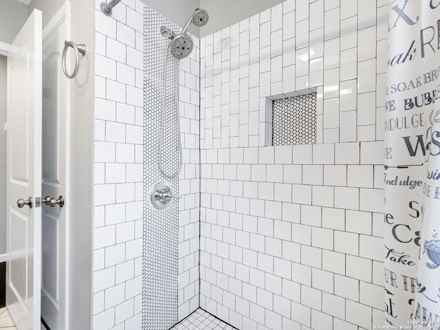 full bath with tiled shower