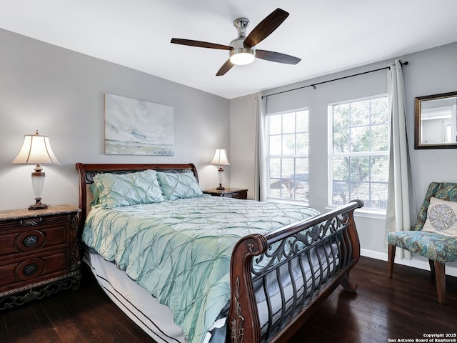 bedroom featuring dark wood-style floors, baseboards, and a ceiling fan