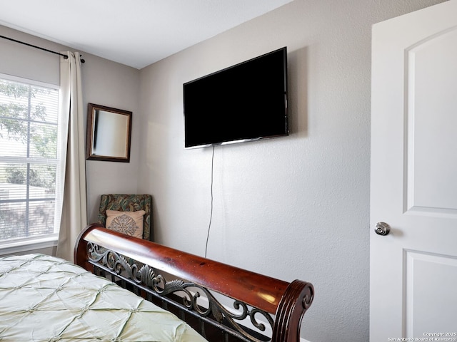 bedroom featuring multiple windows