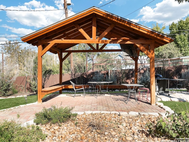 view of home's community featuring a patio area, a fenced backyard, and a gazebo