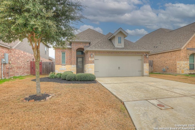 view of front of property with a garage and a front yard