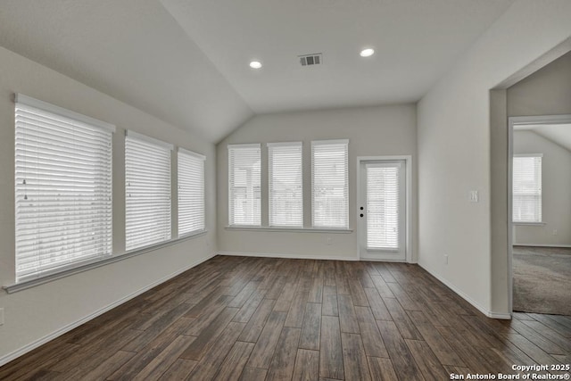 unfurnished sunroom with vaulted ceiling