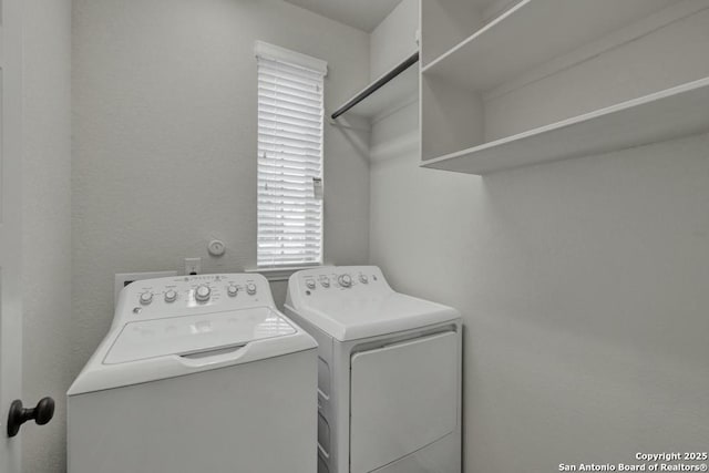 laundry area with washing machine and dryer