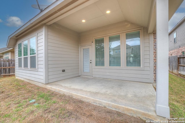 property entrance featuring a patio