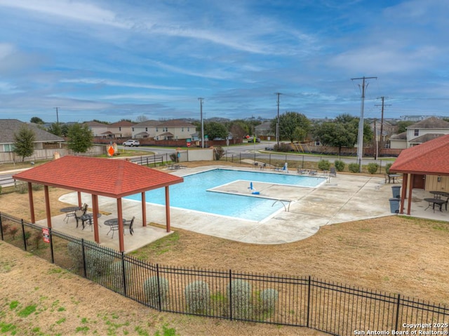 view of swimming pool with a gazebo, a patio area, and a lawn