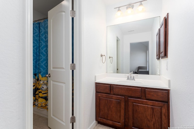 bathroom featuring tile patterned floors and vanity