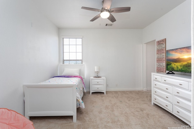 bedroom with ceiling fan and light carpet