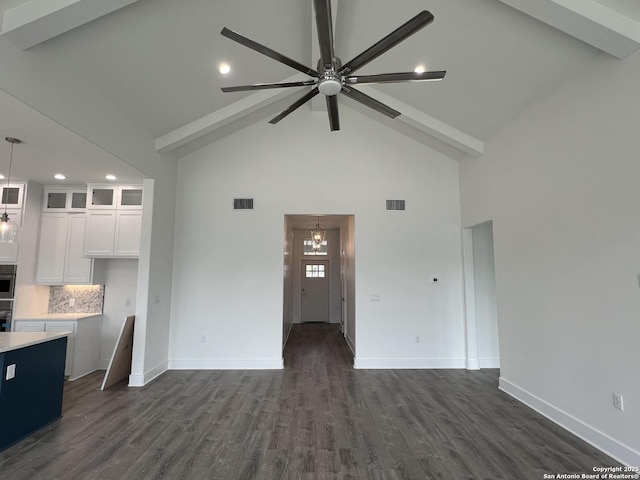 unfurnished living room featuring high vaulted ceiling, dark wood-type flooring, visible vents, and baseboards