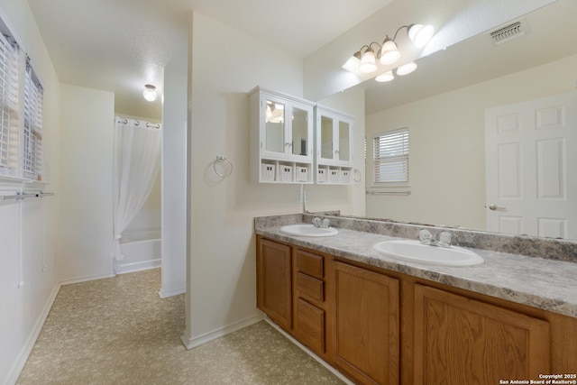 bathroom with vanity and shower / bathtub combination with curtain