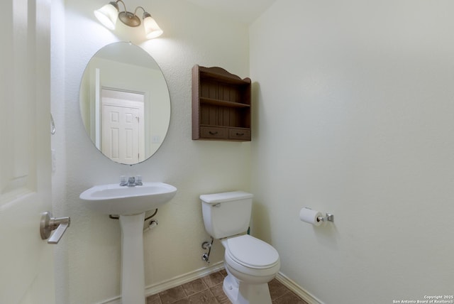 bathroom with sink and toilet