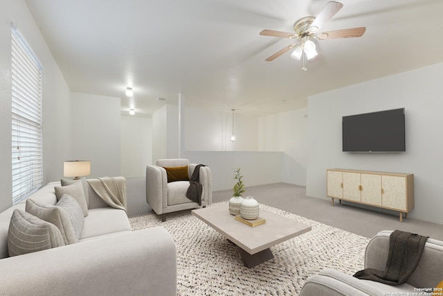 carpeted living room featuring ceiling fan