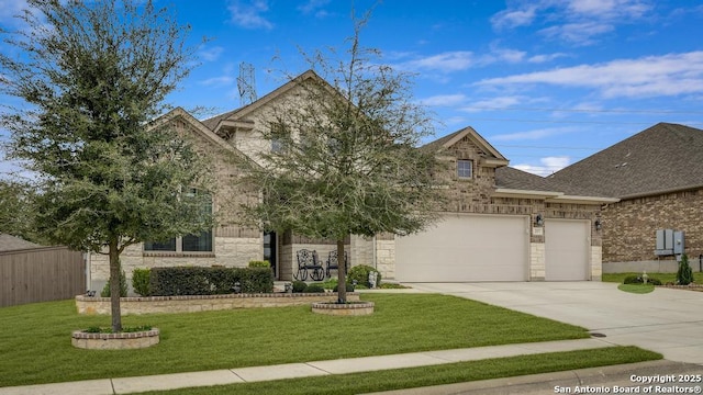 view of front of home with a garage and a front yard