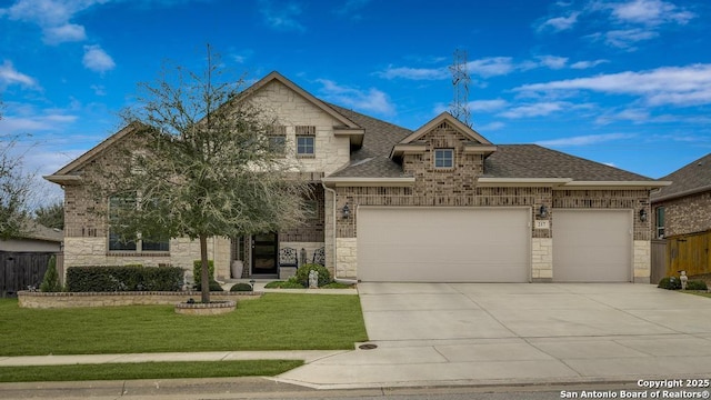 view of front of house with a garage and a front lawn