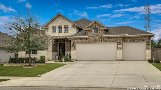 craftsman house with a garage and a front yard