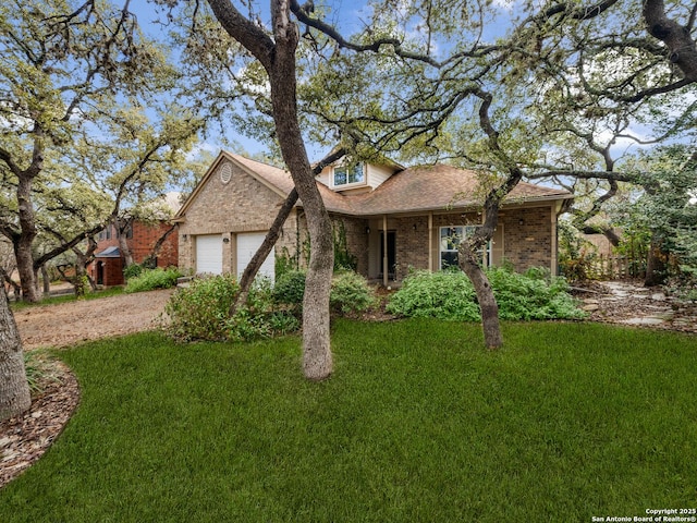 view of front of house with a garage and a front lawn