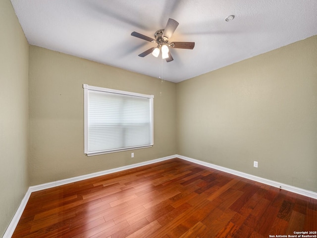 unfurnished room featuring ceiling fan and wood-type flooring