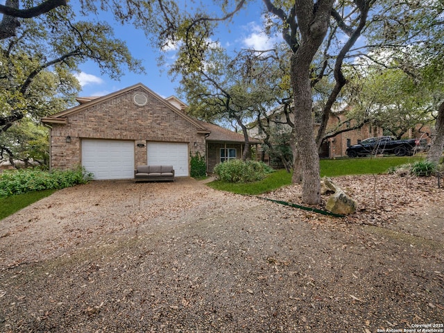 single story home featuring a garage