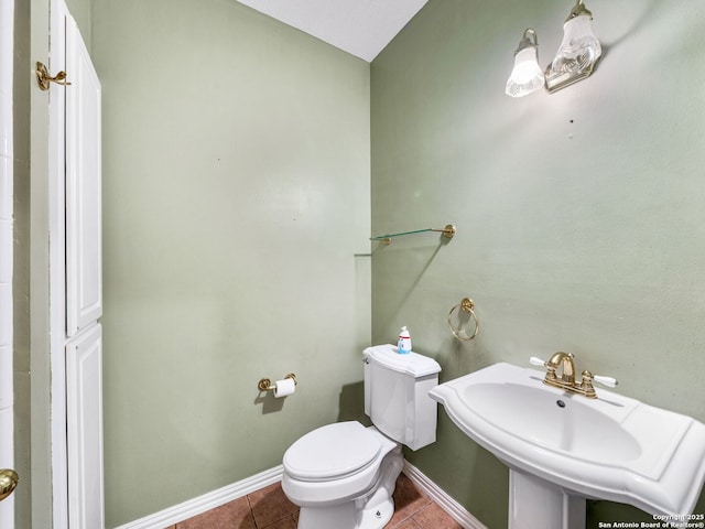 bathroom with sink, tile patterned floors, and toilet